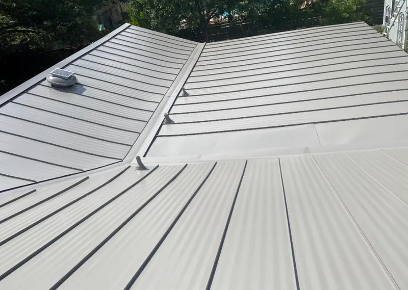 Solar attic fan installed on a metal roof for Roof Ventilation in South Miami